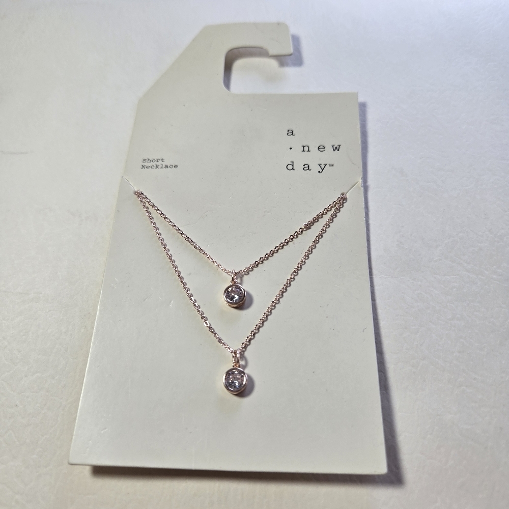 A New Day Gold and Silver Necklace Minimalist Design